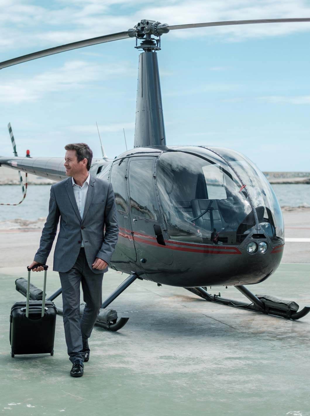 businessman standing near private helicopter 152399881 heli