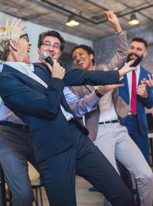 funny teambuilding indoors activity business people making team training exercise building seminar singing karaoke 174544208 teambuilding 4b1a567f