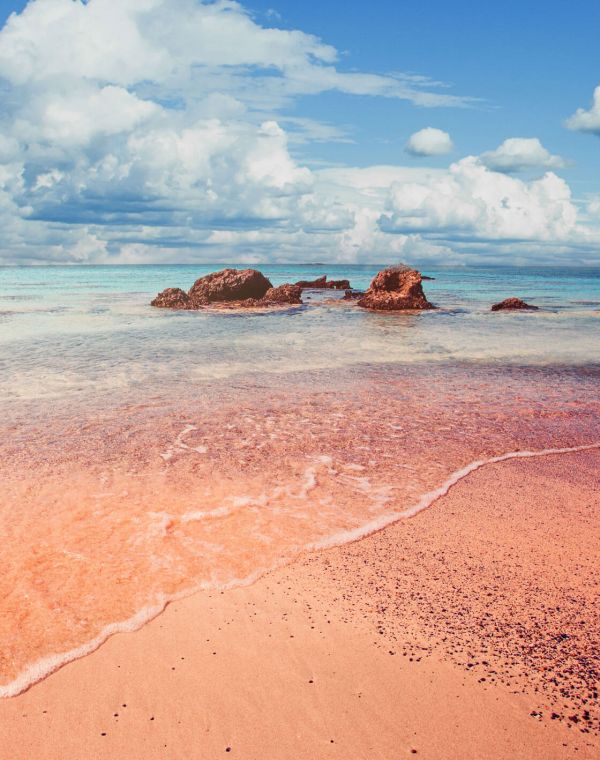 beautiful elafonissi beach crete greece pink sand blue sea water clouds sky islands 02 792bf0f6